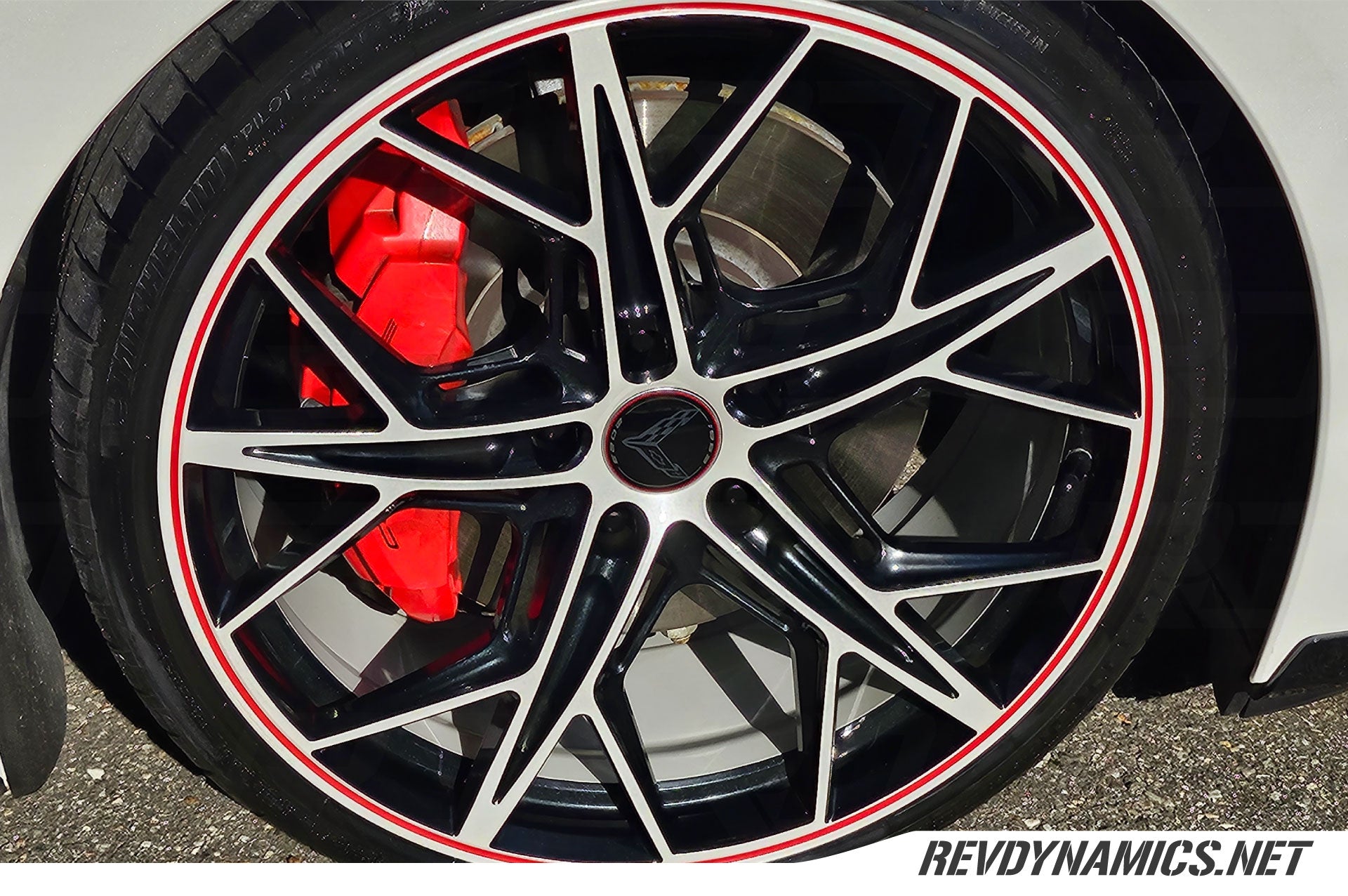 Corvette C8 with color matched wheels in carbon black pearl white and red