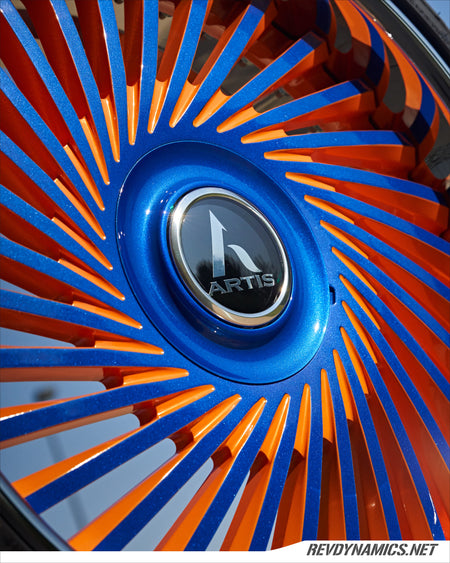Polaris Slingshot Artis Juicy with Lexani LX-Twenty tire custom painted in Stealth Blue and Sunrise Orange 